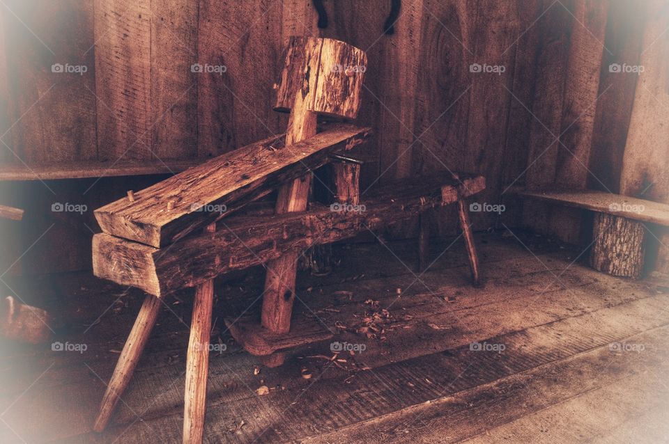 A rustic carving bench in an old homestead.