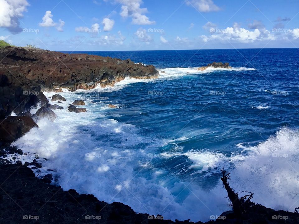 Blue skies, waves, and lava