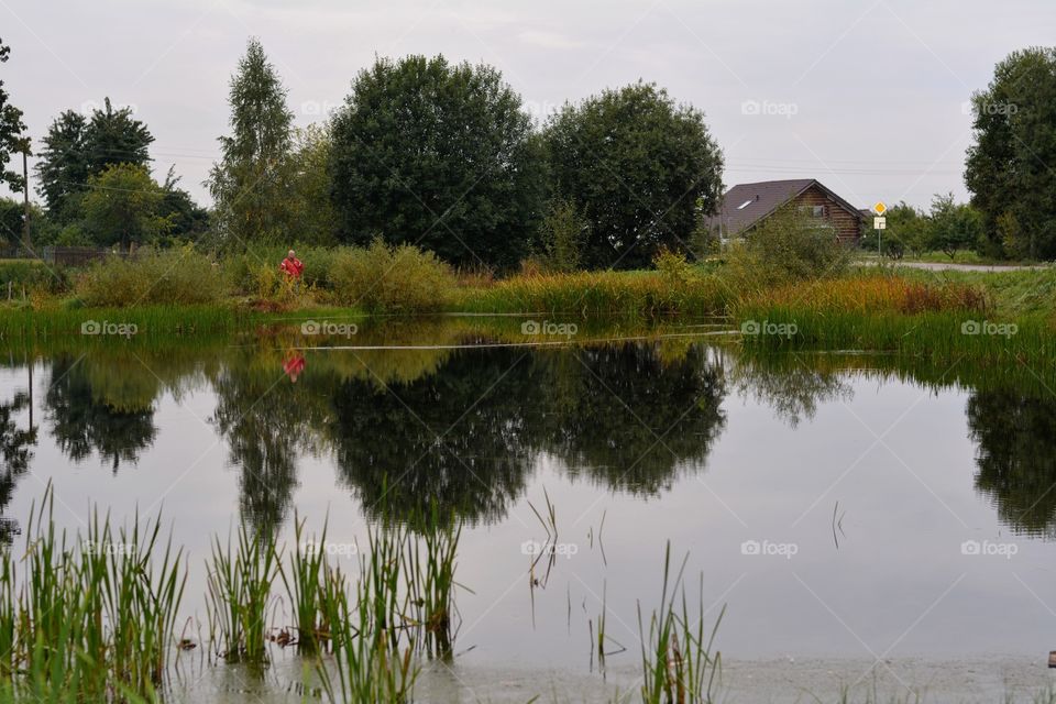 beautiful countryside landscape and fisherman reflection in water lake