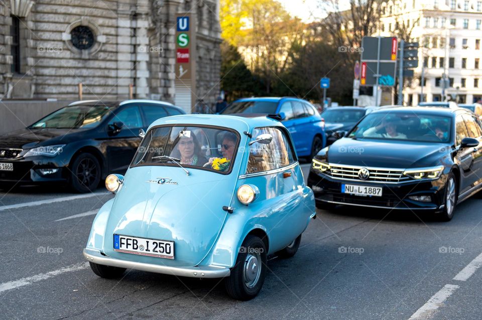 Small retro car on the street in Munich, Germany