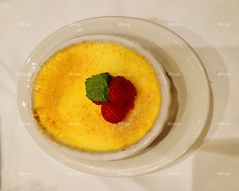 Dessert- Creme Brulee is a dessert consisting of a rich custard base topped with a layer of hardened caramel I zed sugar. Yummy. 