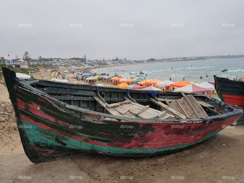 Morocco Moroccan boat and the beach people play playing maroc