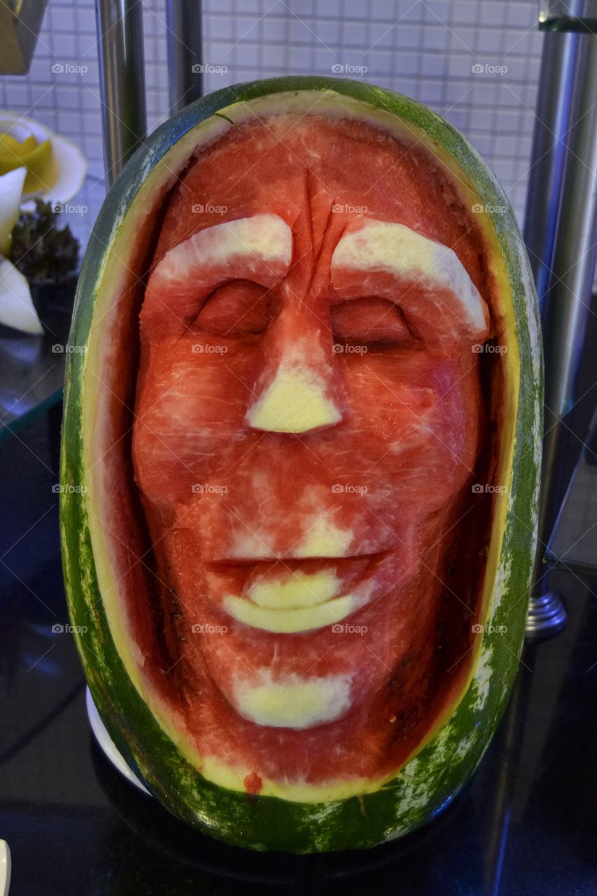 Decorative watermelon in the shape of a face.