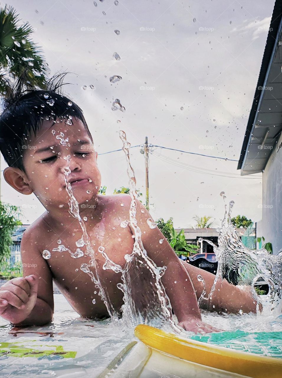 a boy having bath outdoor