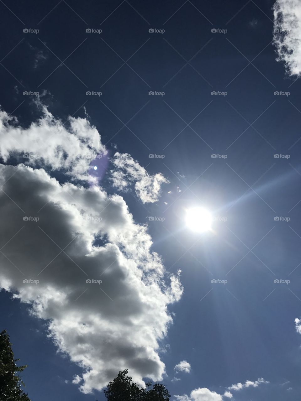 Sun coming out of clouds 