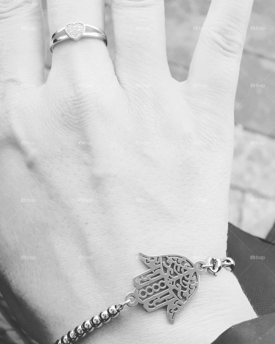 hand with silver jewelry
