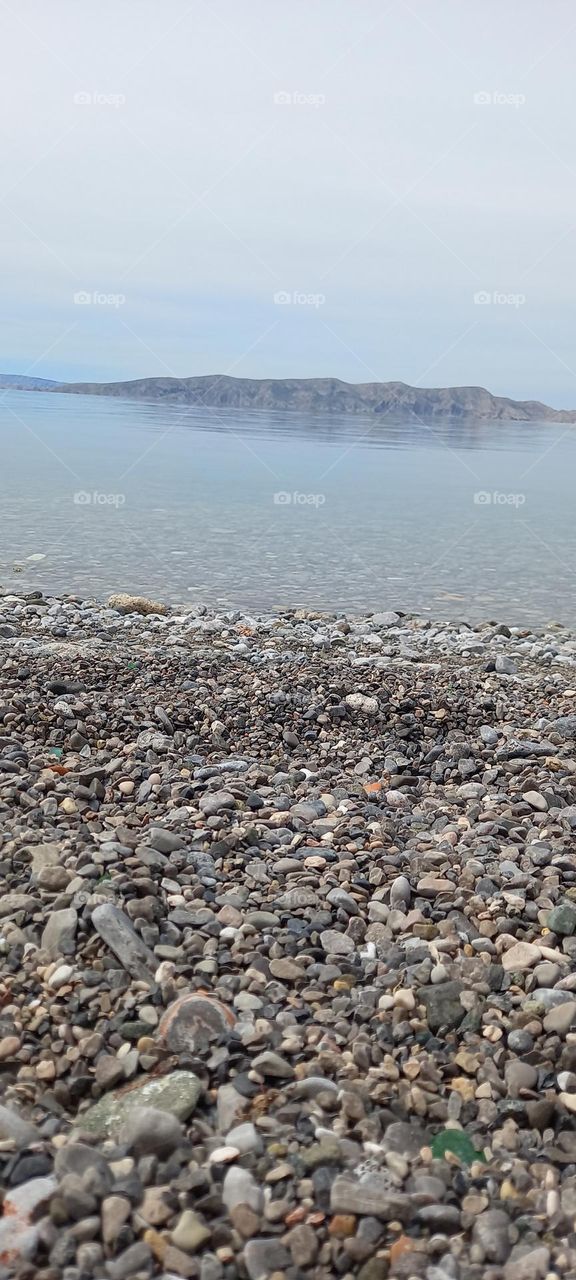 standing at the beach and overlooking the enormous sea