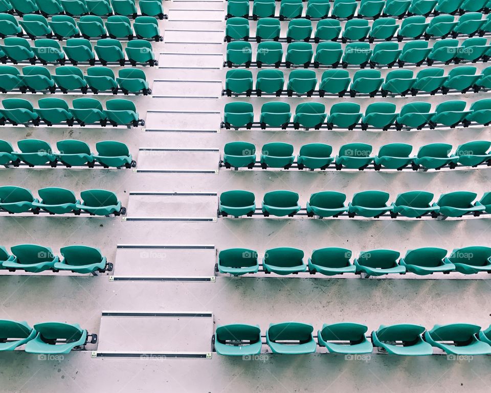 Looking down at stadium seats from above 
