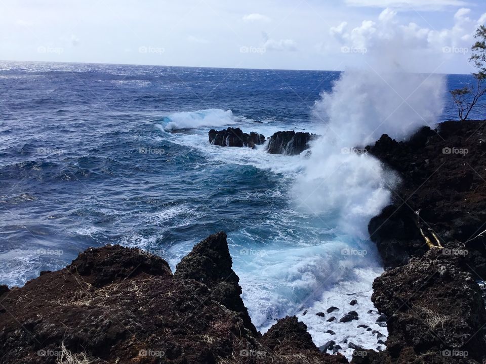 Giant splash on the lava rock