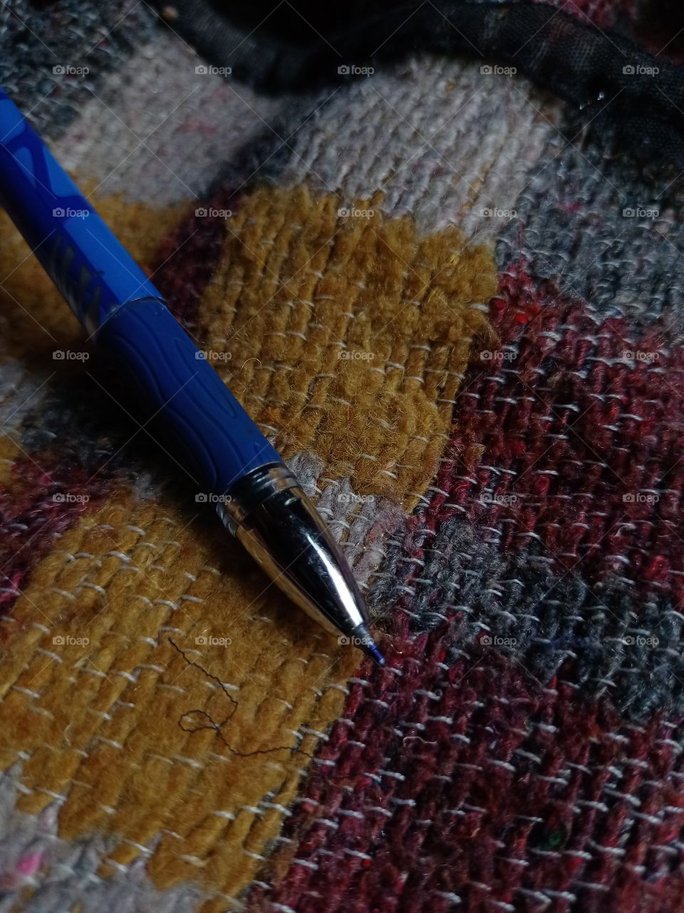 The pen is on the blanket