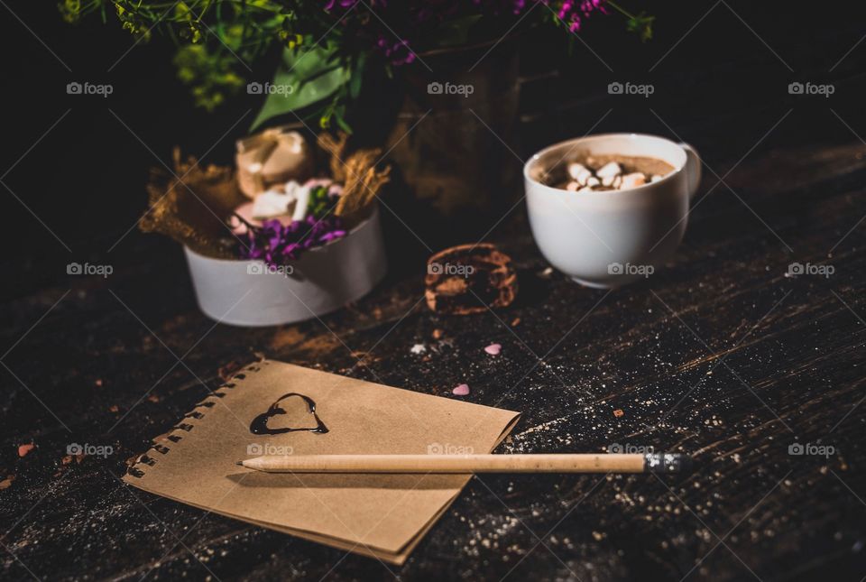 Hot chocolate with macaroons on a wood table 