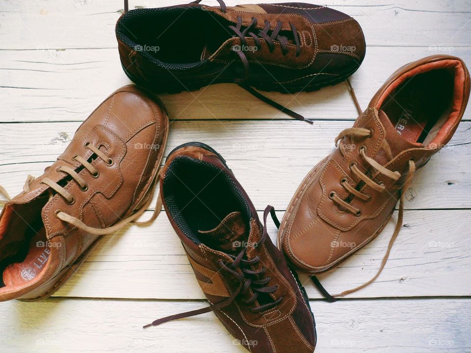 Brown leather men's shoes on a white background