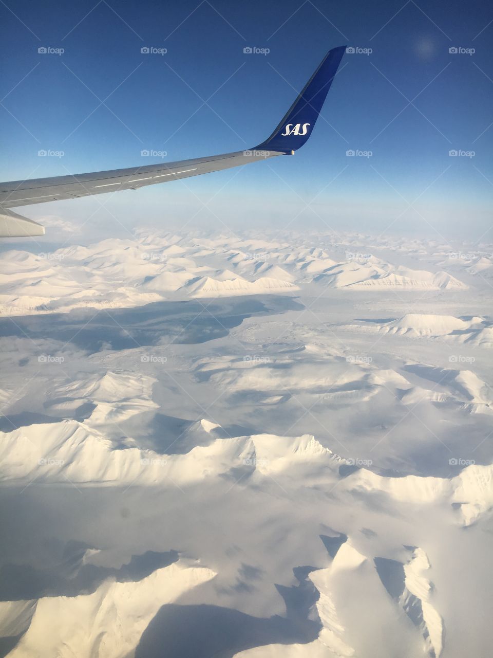 Flying over Spitsbergen, Svalbard. Snowy mountains 