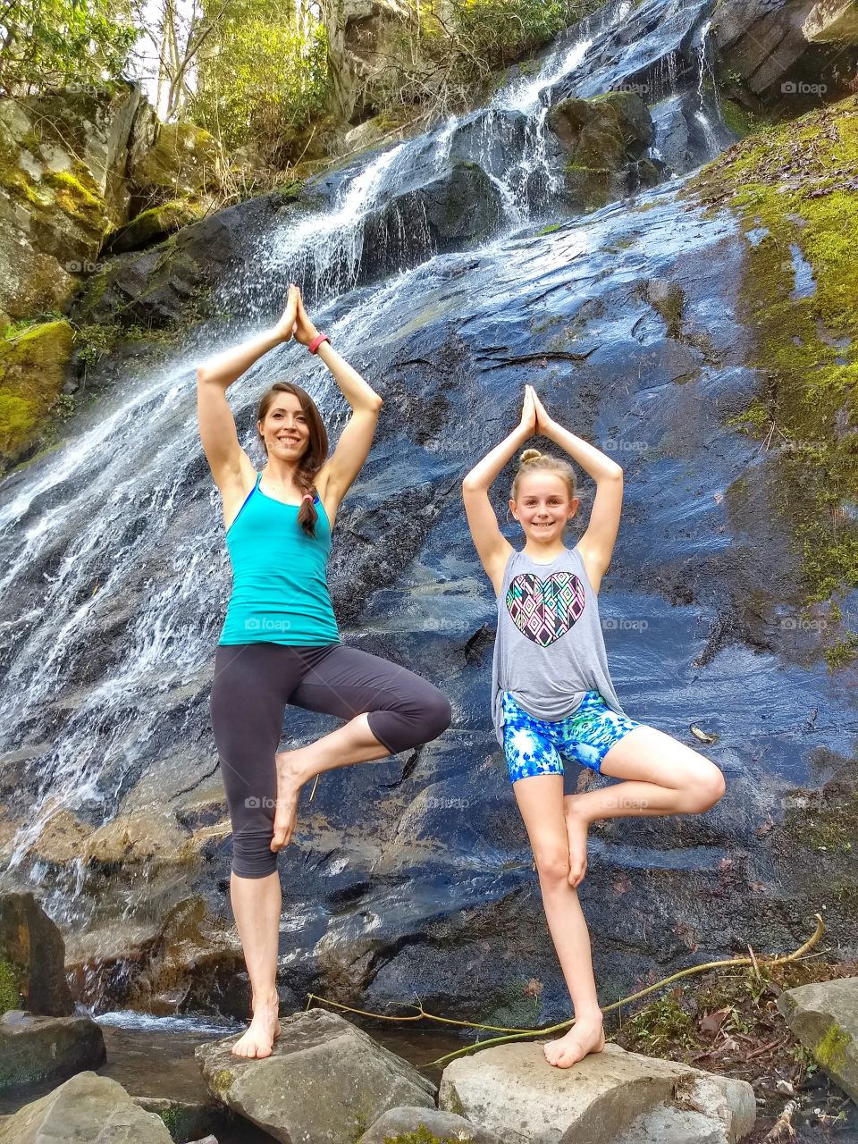 mother daughter yoga by waterfall
