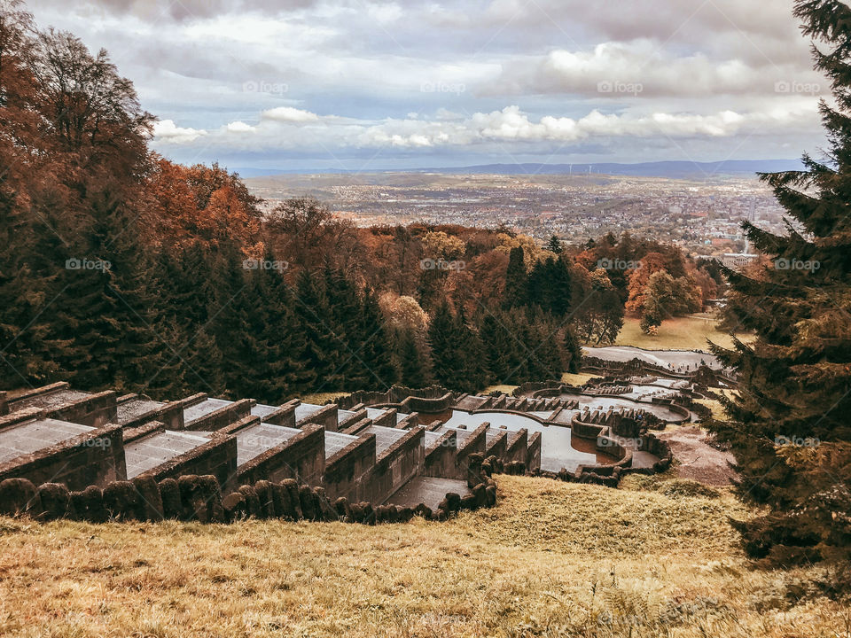 The trees in the fall . Autumn landscape. Forest. Stone constructions with many layers . clouds. changing color. 