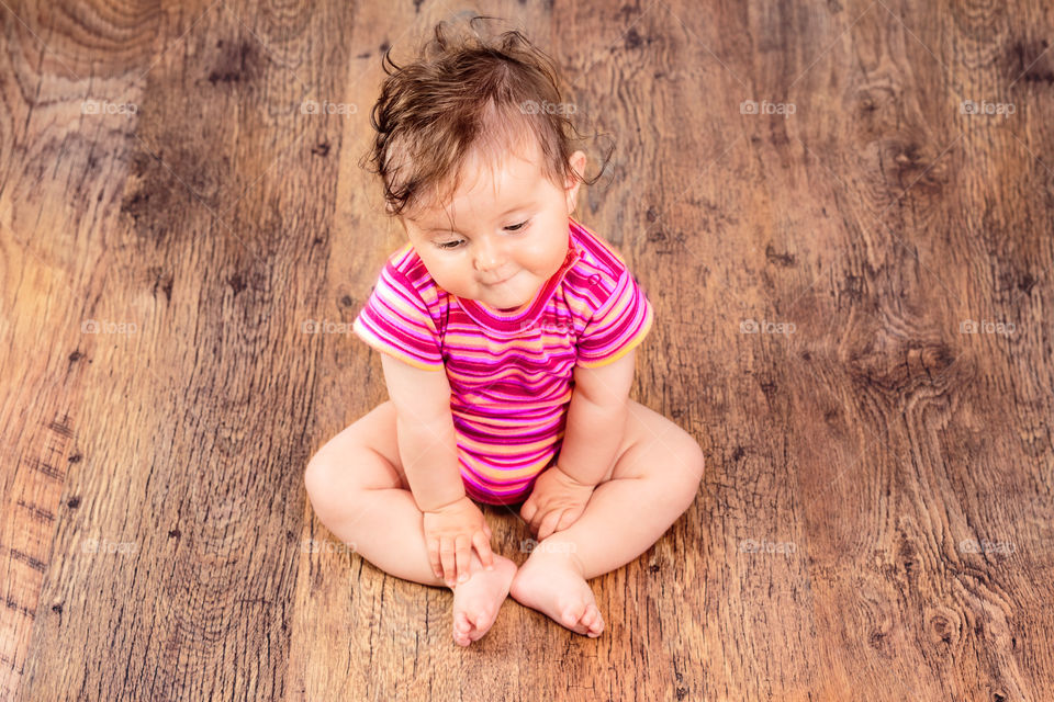 Baby sitting on the floor