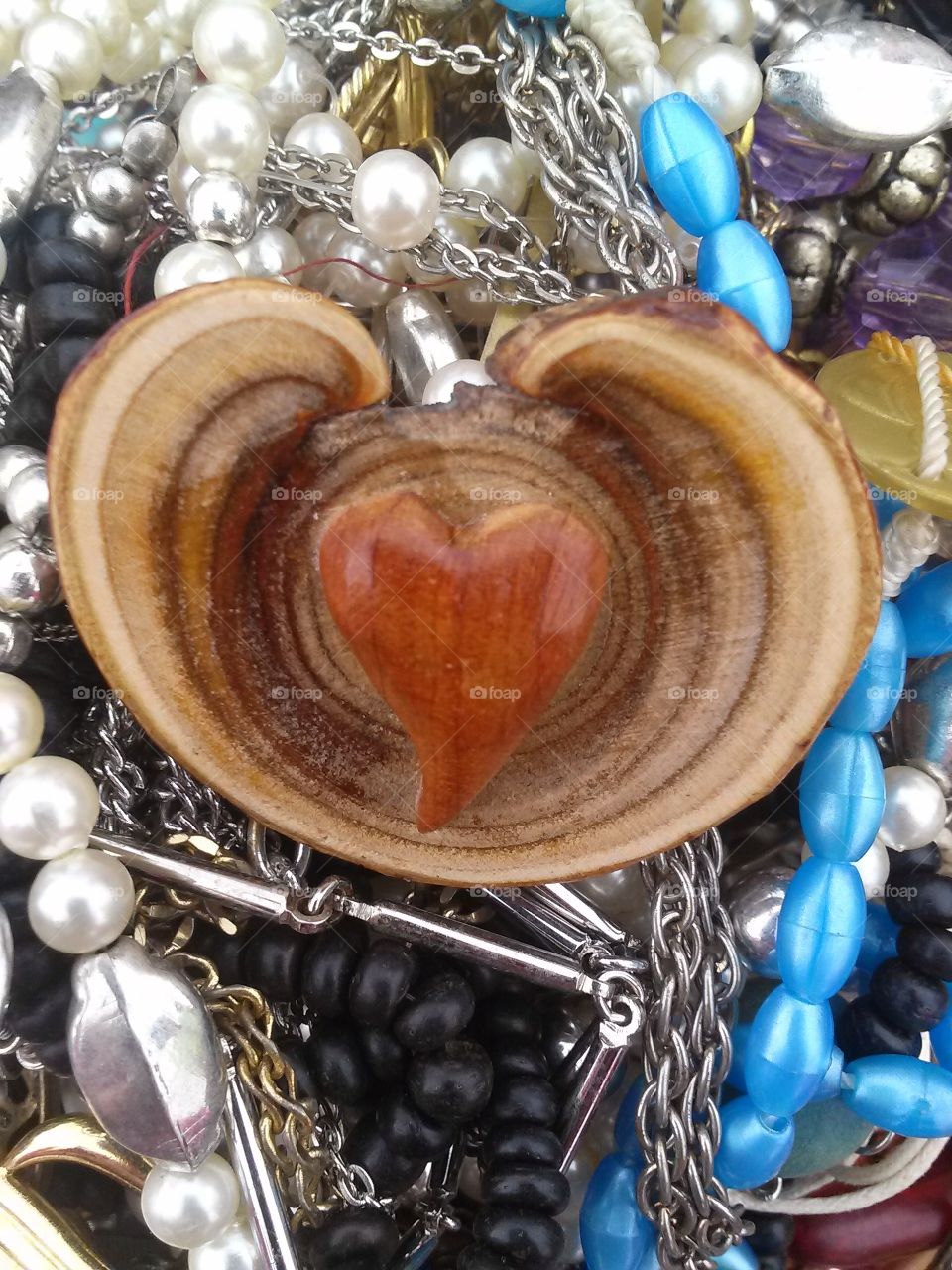 heart wood. wood carving with a heart broach