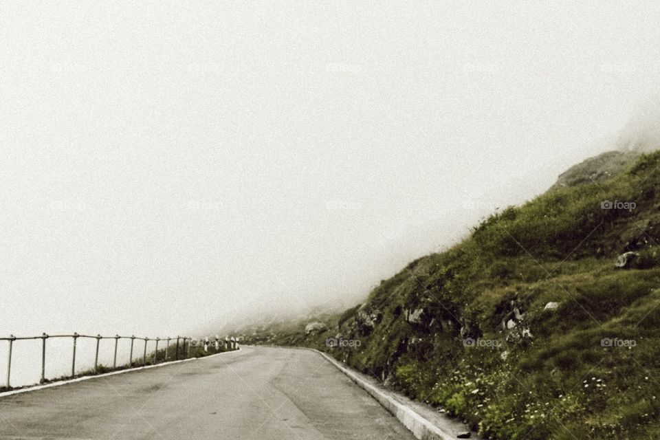 Foggy road at the top of a mountain in Switzerland 