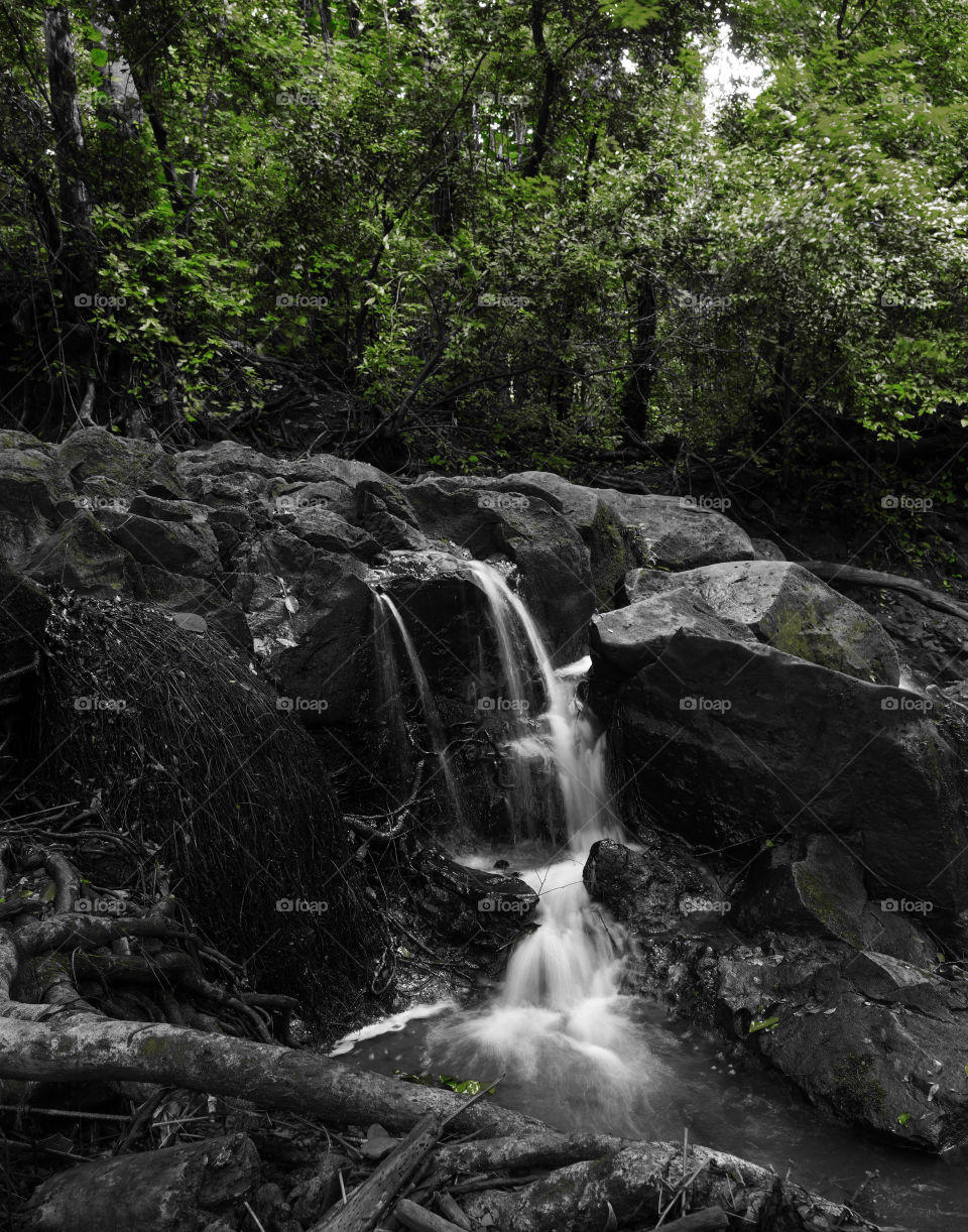 Moody waterfalls on a creek on Oahu Hawaii