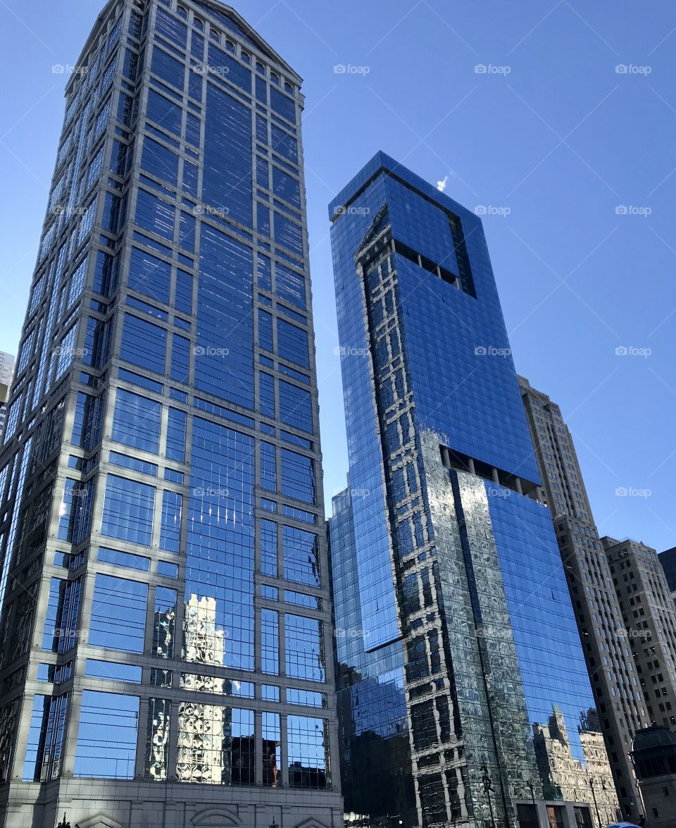Two glass skyscrapers along the Chicago riverfront providing a beautiful backdrop to an already beautiful city