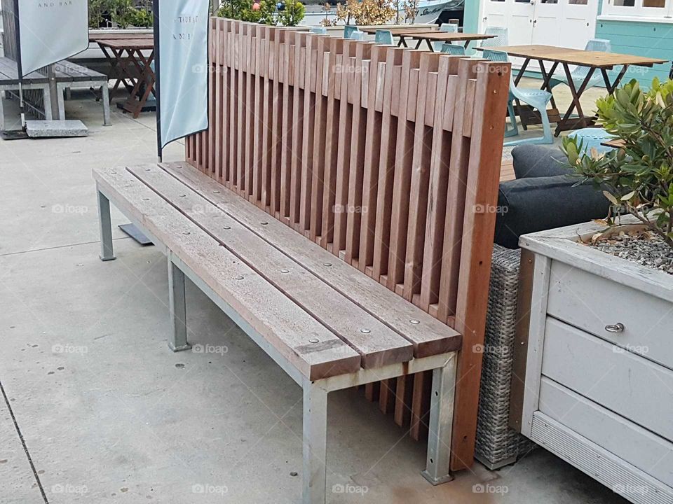 On the streets of Wellington near the ocean was this big wooden seat. A place to rest.