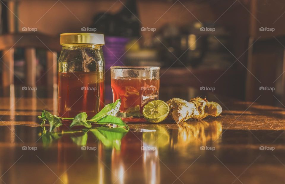 A homemade remedy for common cold and cough, tea with honey, lemon and ginger.