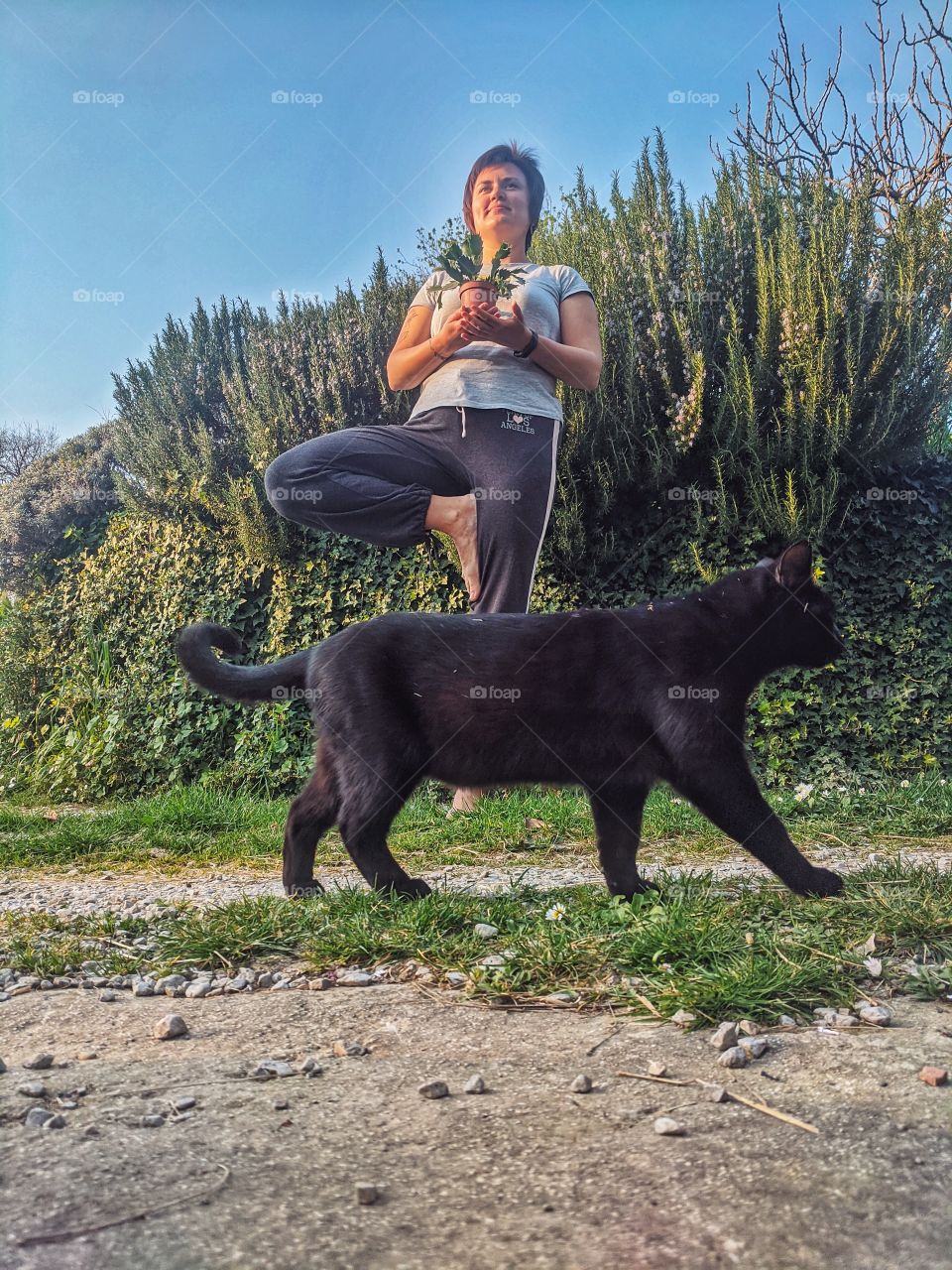 Portrait of beautiful young smiling woman doing yoga poses at the nature at spring. Healthy lifestyle