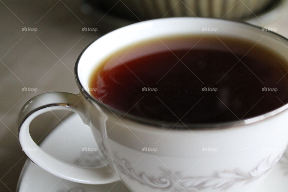 Black tea in a white cup
