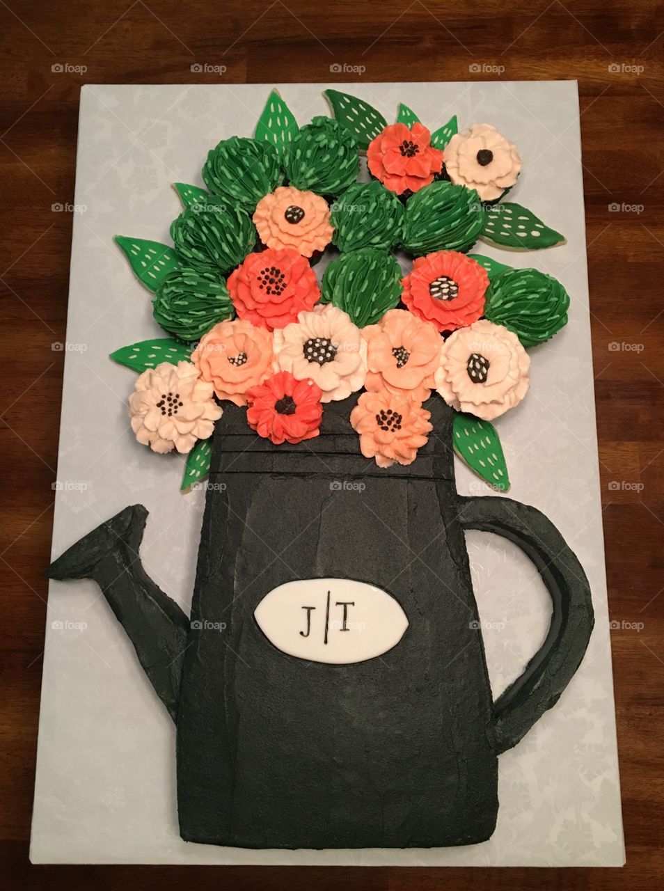 Bridal shower watering can cake with flowers