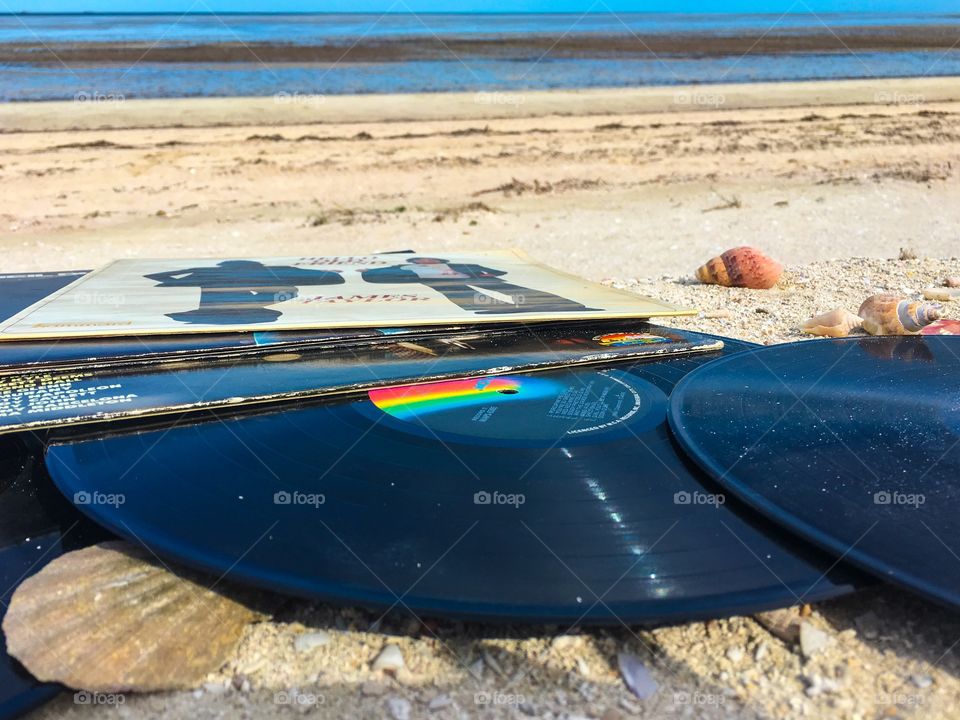 Beach scene vintage vinyl records music sand outdoors