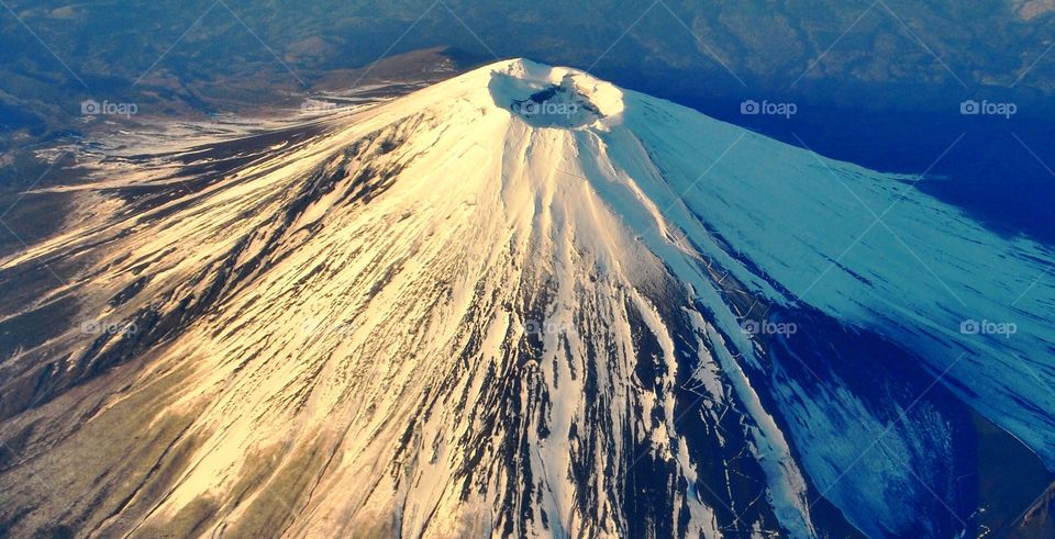 Fuji Mountain from the sky on a clear sky flight. 