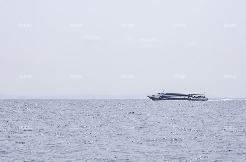 ferry boats transfers visitors in the sea at Koh Kood, Trat in Thailand.