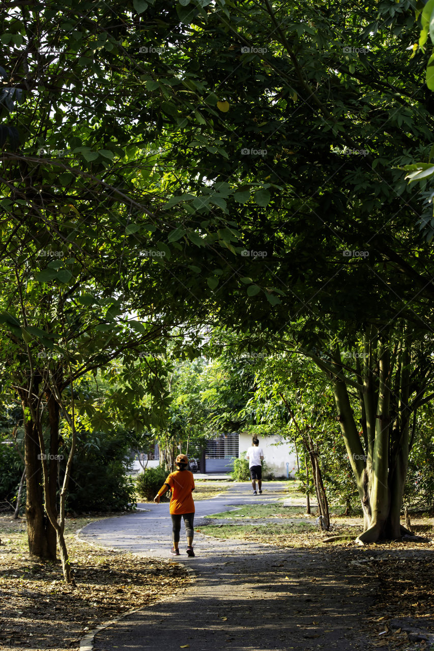 The people running exercise for health in the BangYai park , Nonthaburi in Thailand.