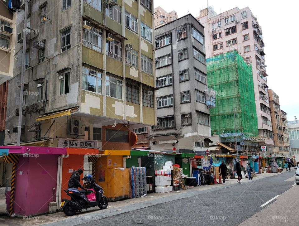 colorful stalls and Chinese buildings on Wun Sha Street Hong Kong