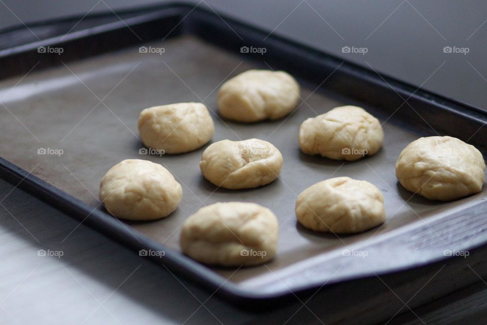 Bread dough on a baking tray before going to the oven