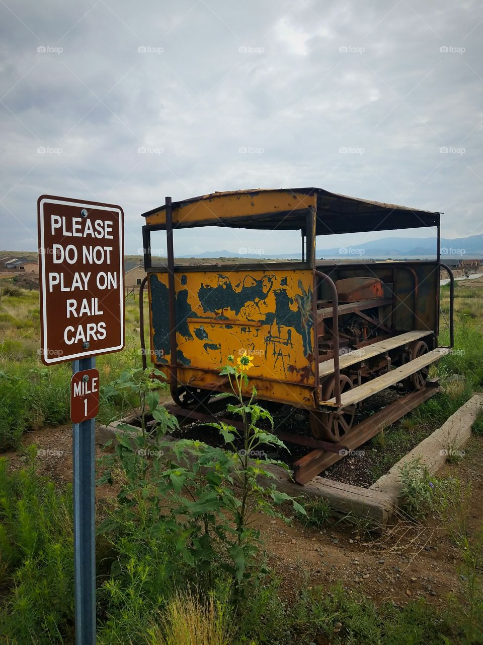 "Please do not play on rail car" sign and railcar.
