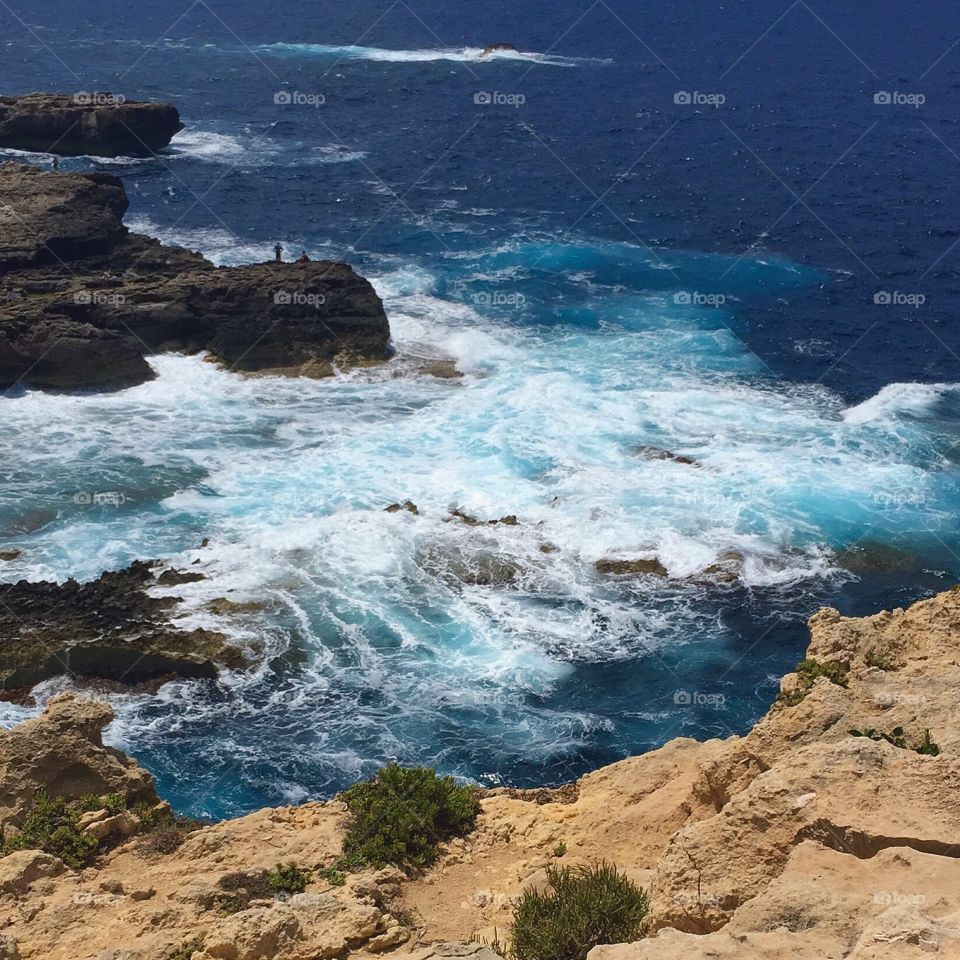 Rough waters on Gozo island (near Malta) that create a stunning array of blues and whites! 