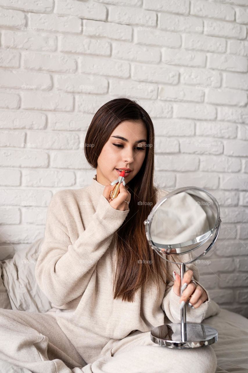 woman using cosmetics