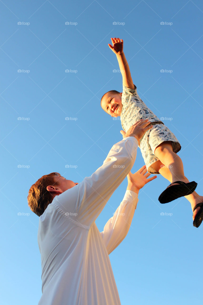 Son playing with his father