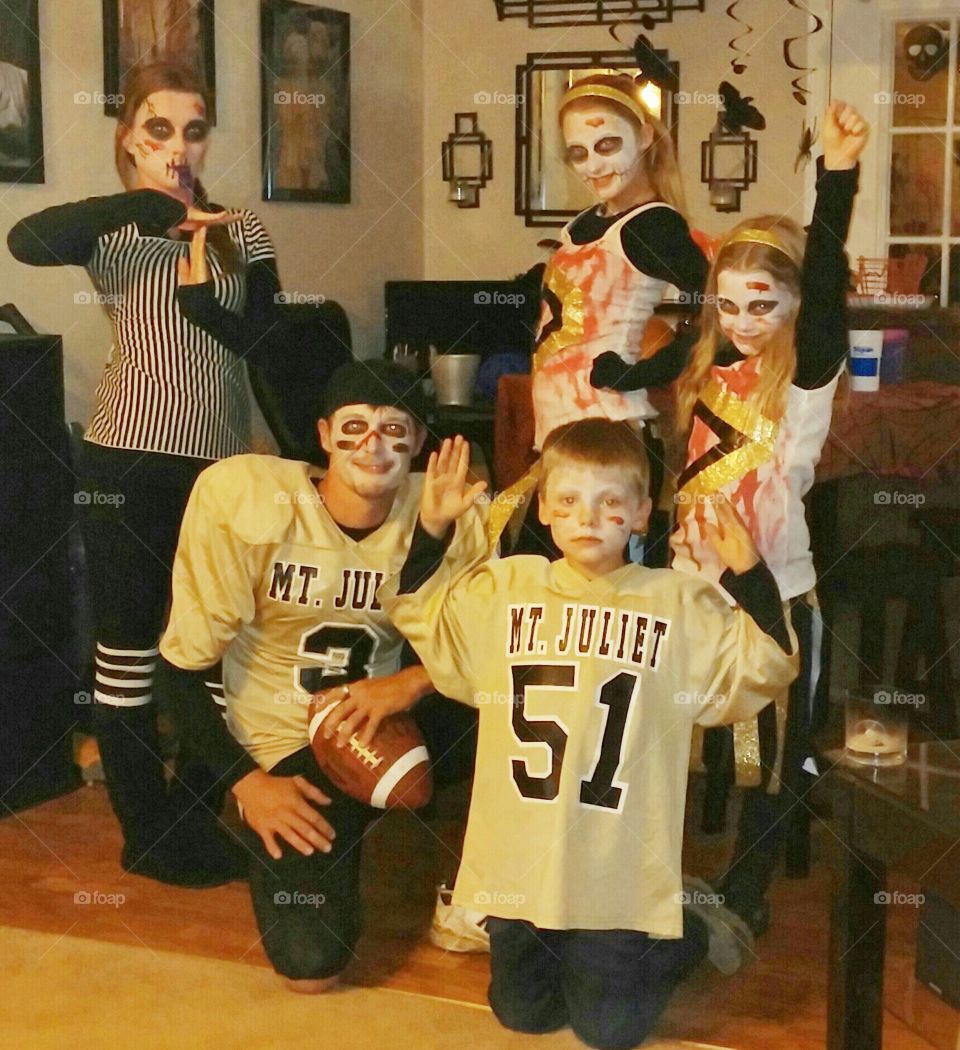 zombie football. family dressed up as zombie football team for Halloween