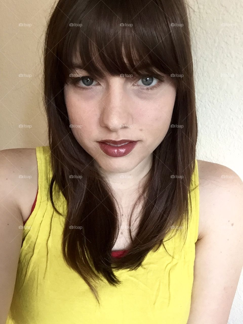 Cut my own bangs and felt good about it. Taken during my summer marketing internship in Colorado. I was 20 with blue eyes and a fair complexion.