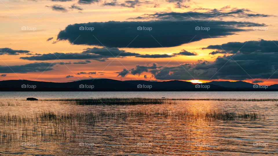 Dramatic cloudy sunset over Corrib lake in Galway, Ireland