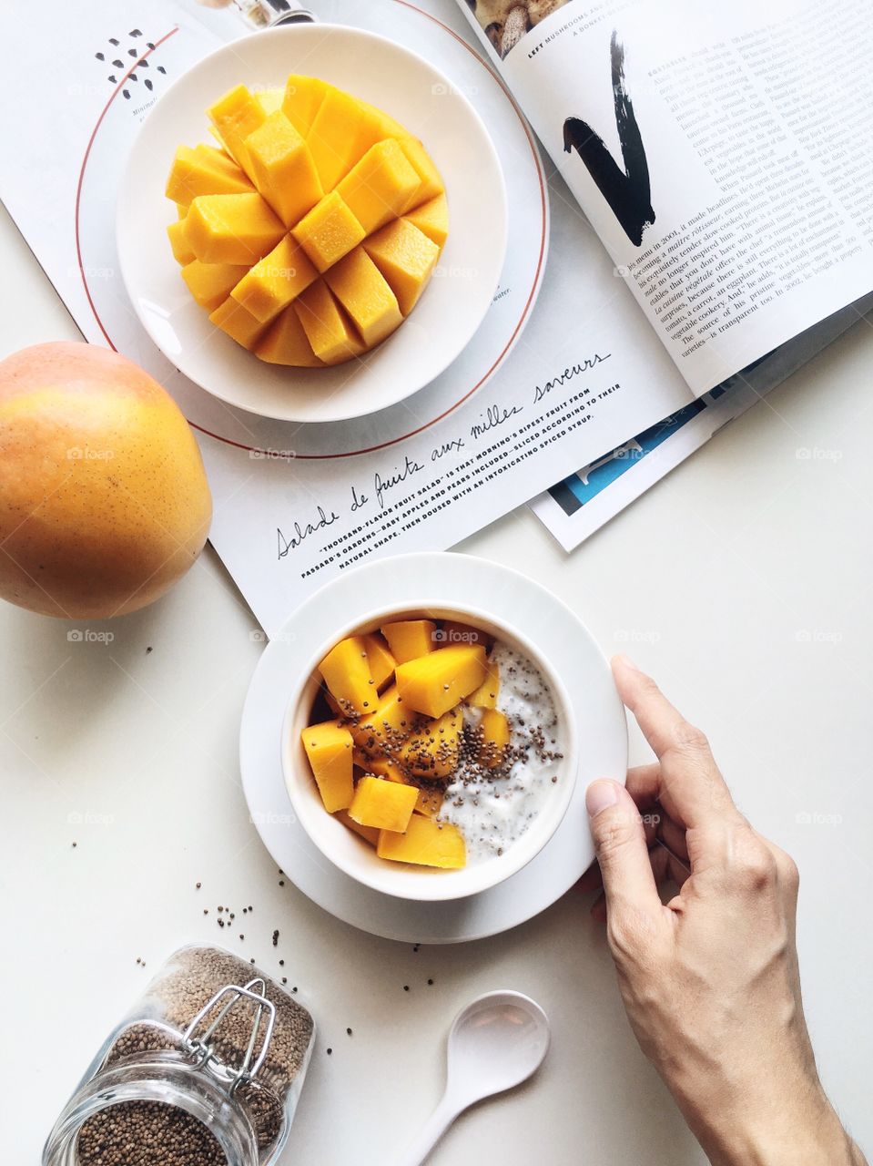 Healthy breakfast bowl with R2E2 mango, yogurt, chia seeds and perilla seed.