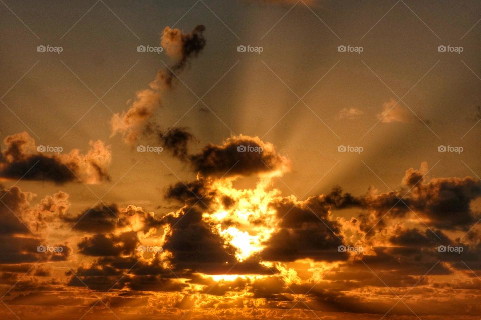 A beautiful sunrise cloudscape with sun rays