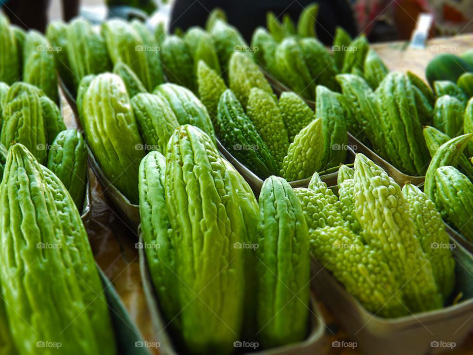 Bitter Melon Cucumbers, Farmers Market. I photographed these bitter melon cucumbers at the Farmers Market in Kansas City. I added vibrance and a tilt shift effect.