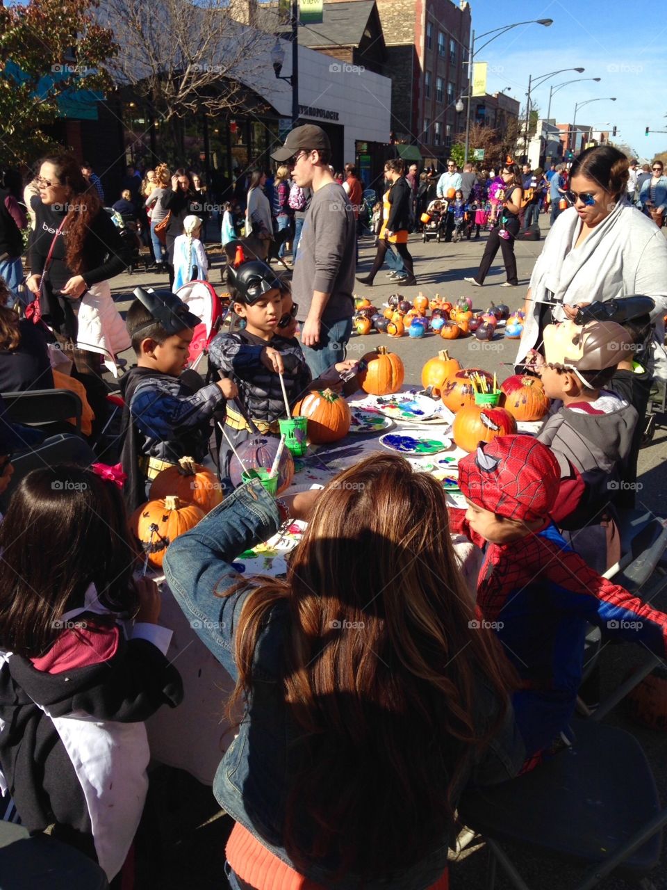 Children painting pumpkins. Fall festival 