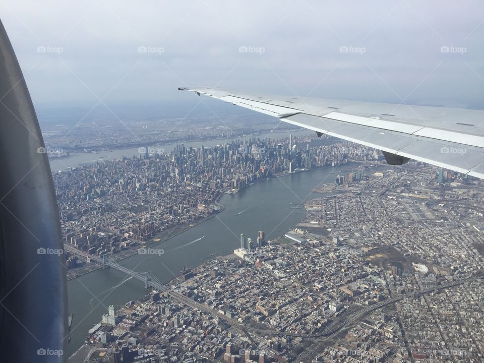 New York City from the air: Manhattan, Brooklyn, and Queens with a view of Midtown, Williamsburg, and Long Island City. 