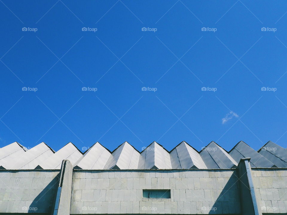 roof of a building against a blue sky