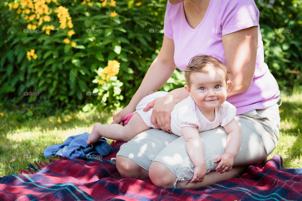 Mother with baby in a garden