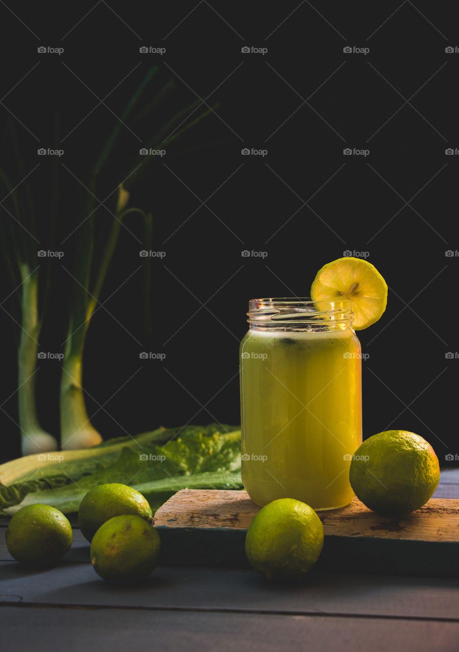 A lemon juice and green elements